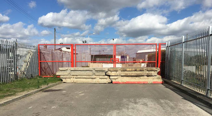 Concrete Barriers Blocking a Gate
