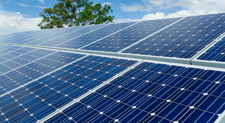 Solar panels on factory roof.