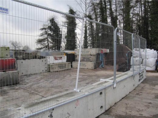 Steel fencing used in combination with concrete barriers for additional security